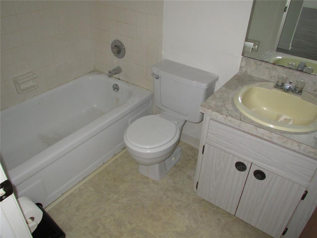 21405 Olean Boulevard, Unit 303 Port Charlotte, FL 33952 - Photo 6 of 7 a bathroom with a sink and a toilet