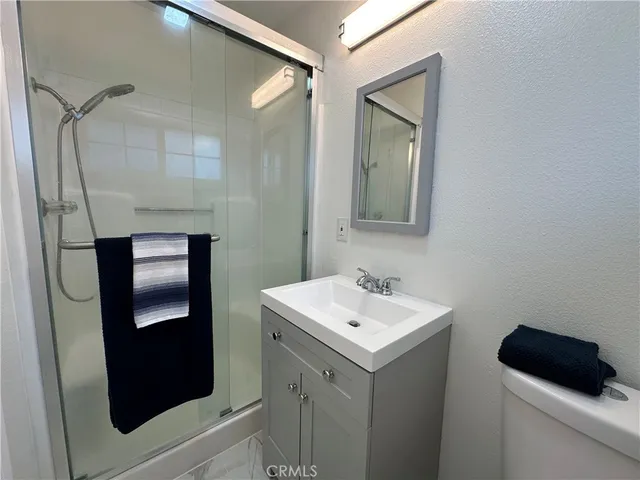 a bathroom with a sink and mirror
