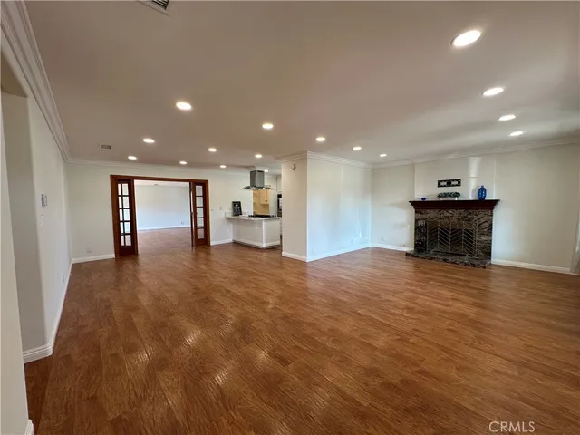 a view of kitchen with a sink and a refrigerator