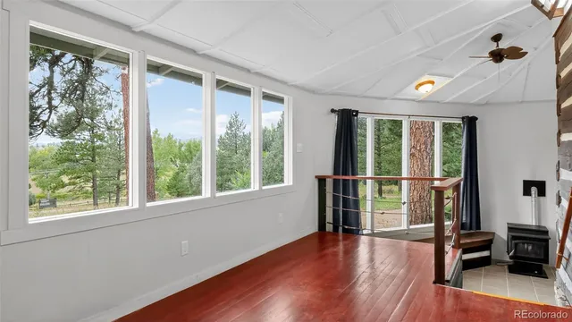 a view of livingroom with furniture wooden floor and windows