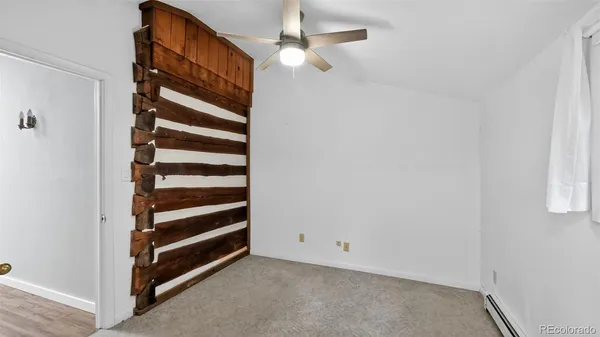 a view of closet with wooden floor