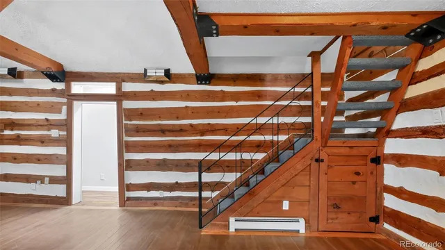 a view of entryway with wooden floor