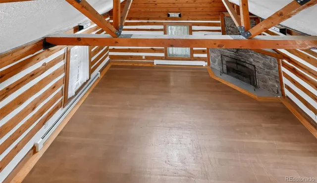 a view of an empty room with stairs