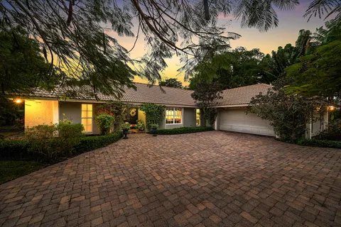 $995,000 | 416 South Country Club Drive, Atlantis, FL 33462