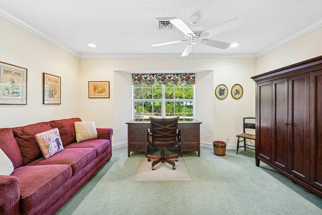 a bathroom with a granite countertop sink a toilet and shower