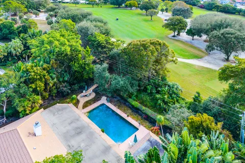 $995,000 | 416 South Country Club Drive, Atlantis, FL 33462
