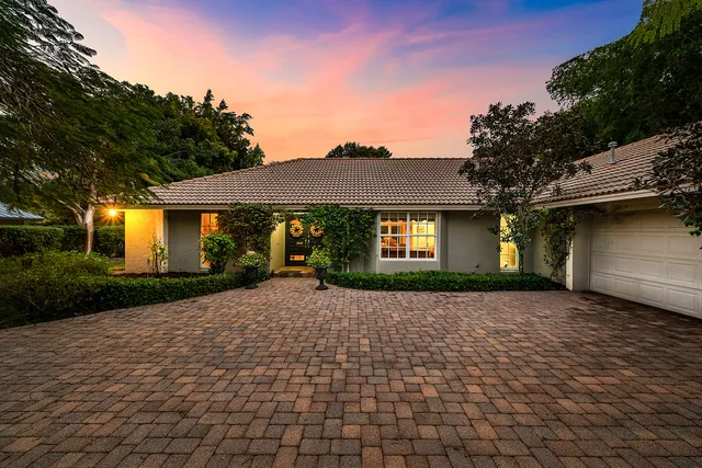 a front view of a house with yard
