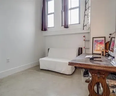 a workspace with furniture and window