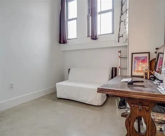 a workspace with furniture and window