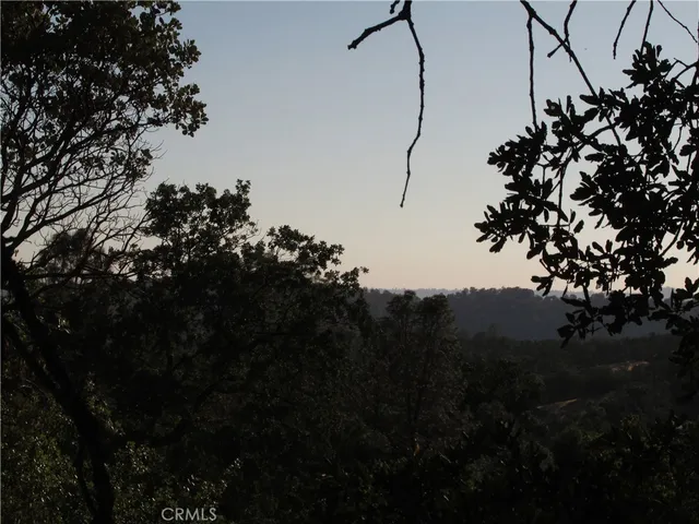 a view of a road with mountains in the background