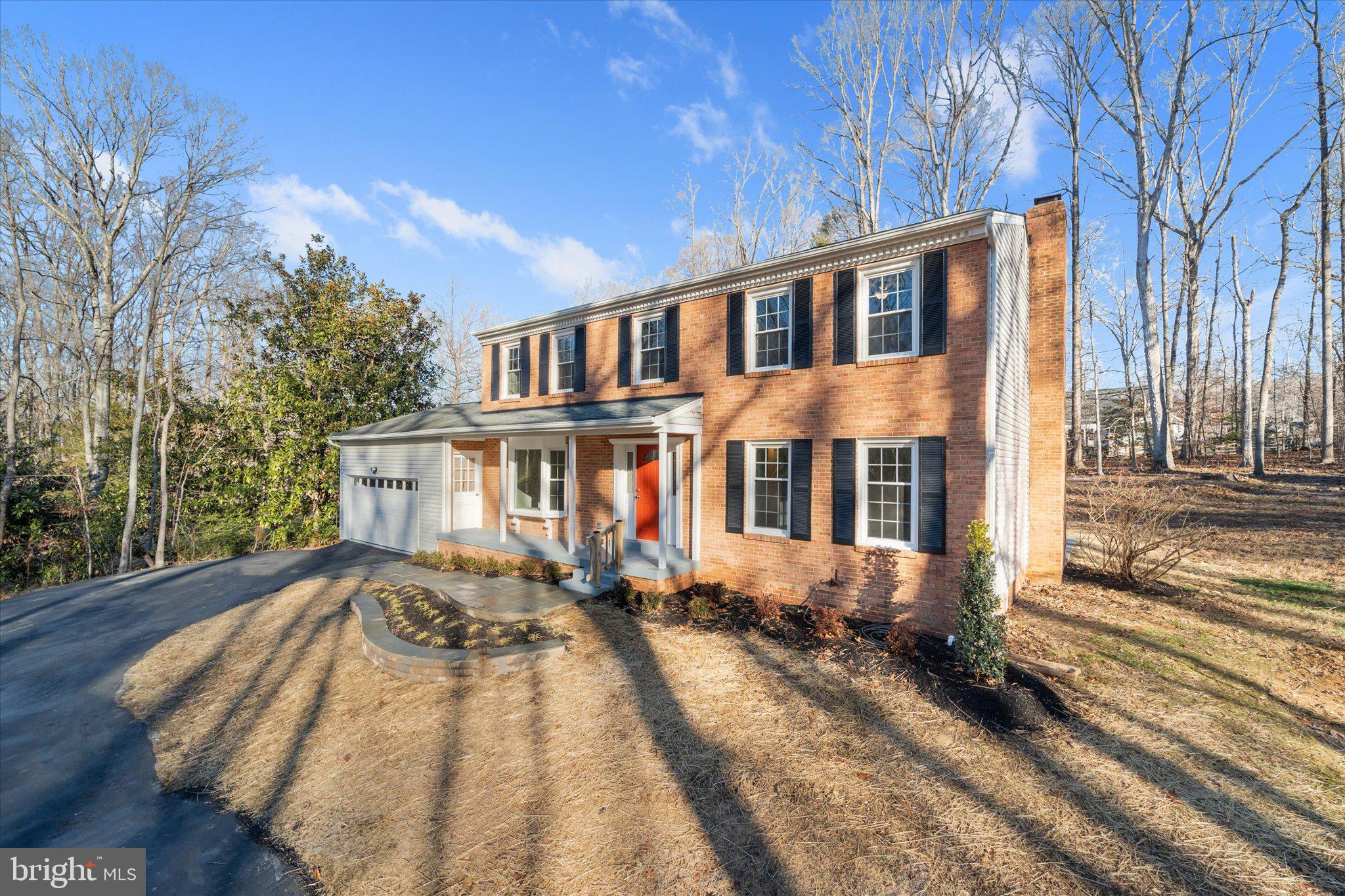 8016 Stillbrooke Road Manassas, VA 20112 - Photo 41 of 41 a front view of a house with a yard