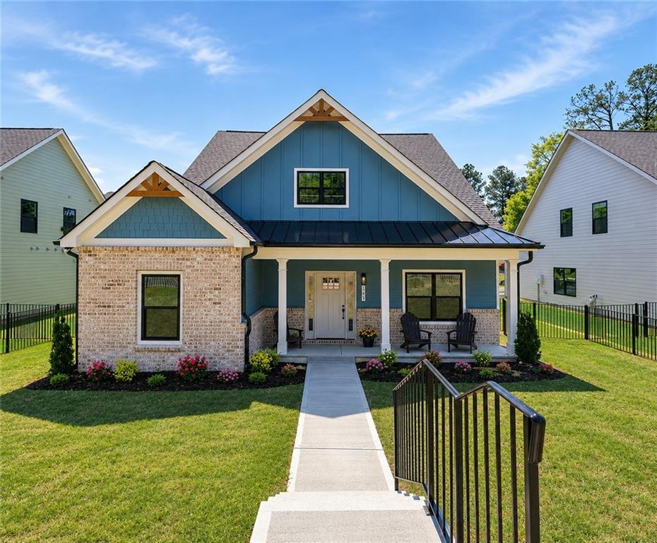 141 Old Alabama Road Southeast Emerson, GA 30137 - Photo 1 of 47 a front view of a house with garden