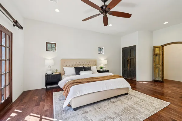 a bedroom with a bed and a walk in closet