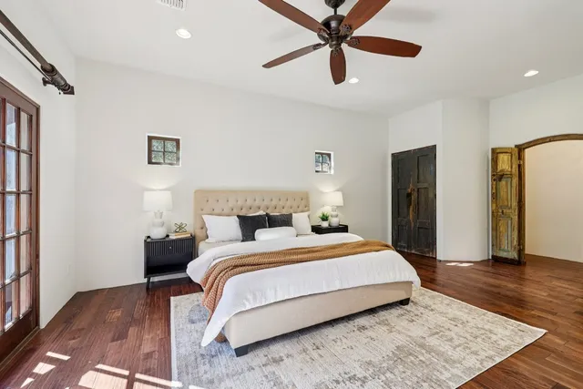 a bedroom with a bed and a walk in closet