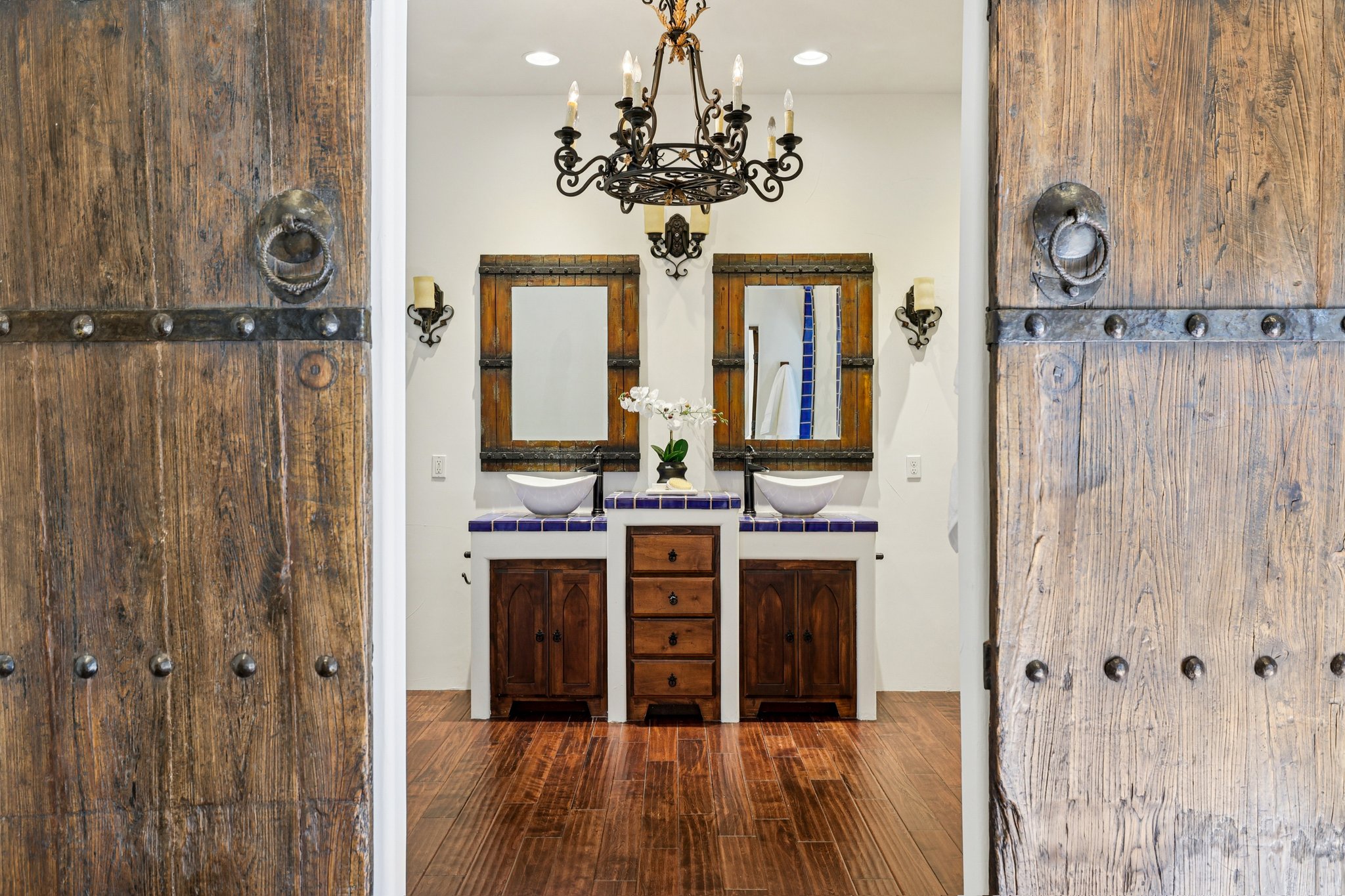 2706 Pearce Road Austin, TX 78730 - Photo 25 of 37 a view of a hallway with wooden floor and chandelier