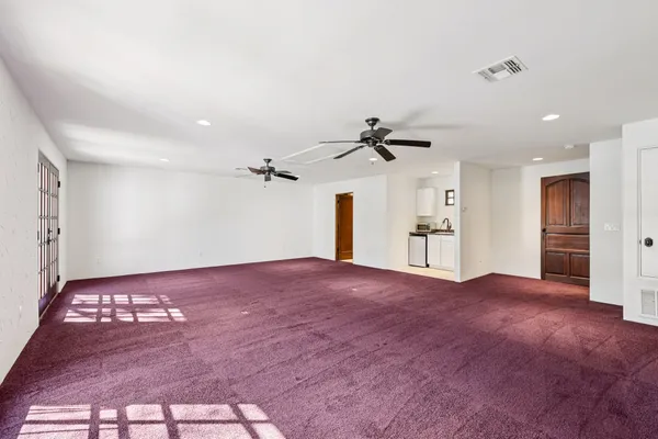 a view of a hallway with windows