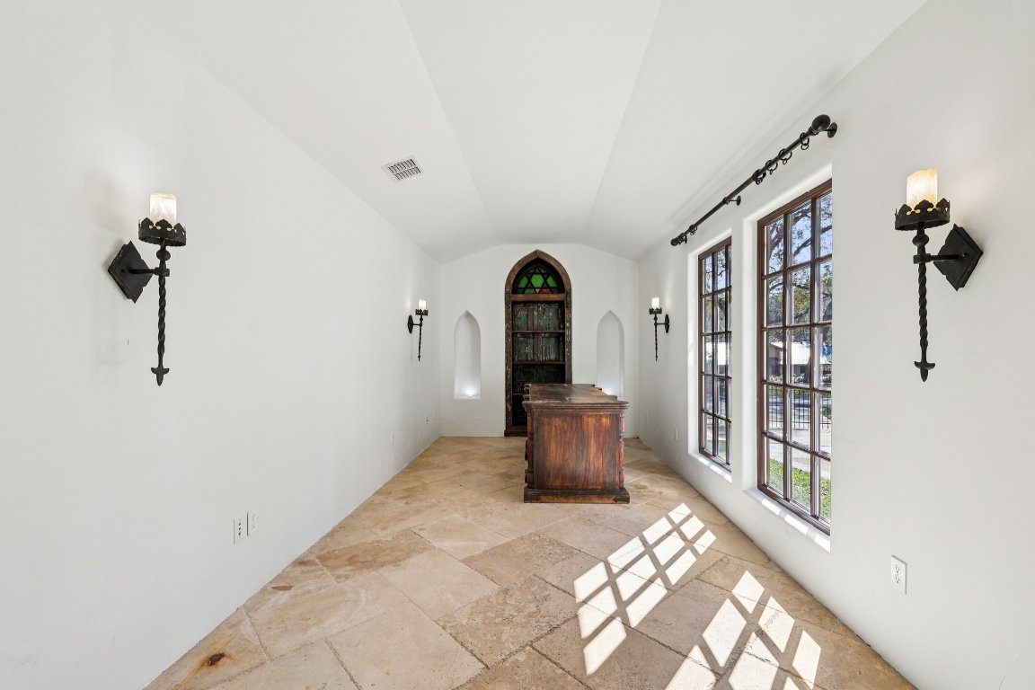 2706 Pearce Road Austin, TX 78730 - Photo 30 of 38 Work from home in comfort in the private office, tucked away to ensure quiet focus.