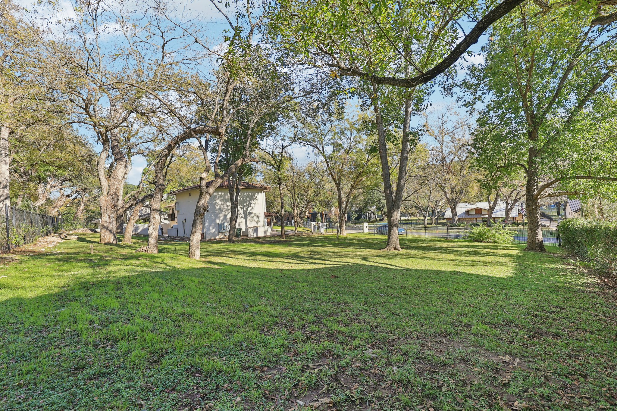 2706 Pearce Road Austin, TX 78730 - Photo 32 of 37 a garden view with a fountain