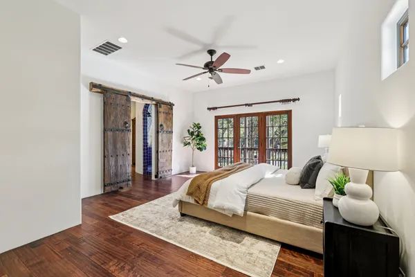 a bedroom with a bed and window