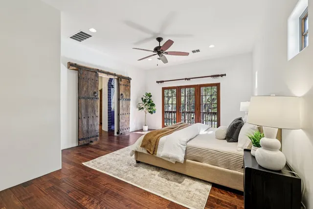 a bedroom with a bed and window