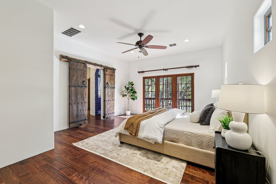 2706 Pearce Road Austin, TX 78730 - Photo 7 of 38 The secluded primary suite commands the entire top level for maximum privacy.