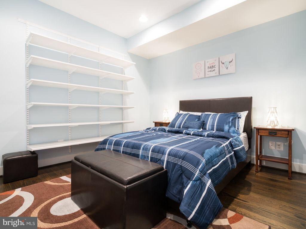 732 Girard Street Northwest, Unit 1 Washington, DC 20001 - Photo 3 of 10 a bedroom with a bed and a window