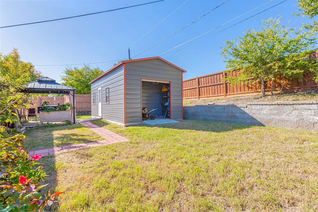 6501 Patsy Lane Watauga, TX 76148 - Photo 22 of 24 a view of yellow house with swimming pool