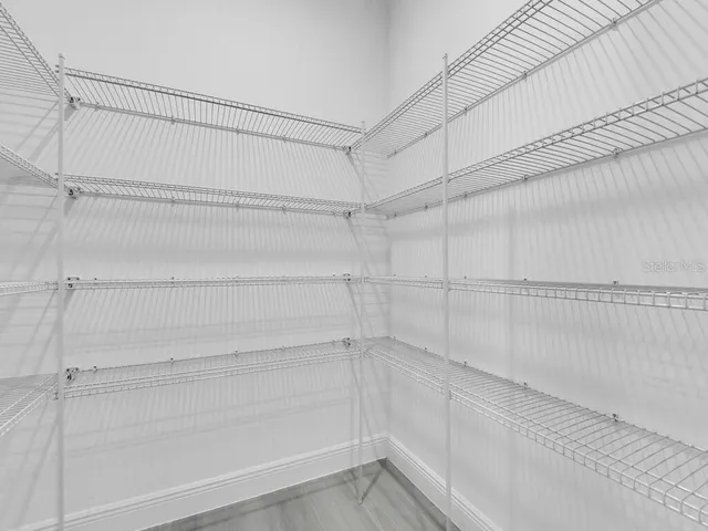 a view of a room with racks on the wall