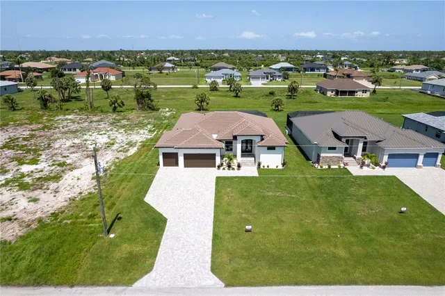an aerial view of a house with a garden