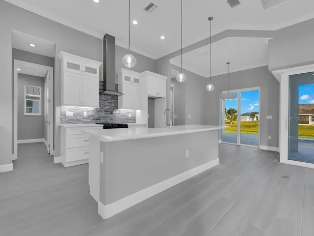 a view of kitchen with center island and stainless steel appliances
