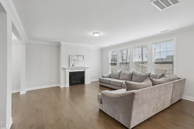 a dining room with furniture and wooden floor