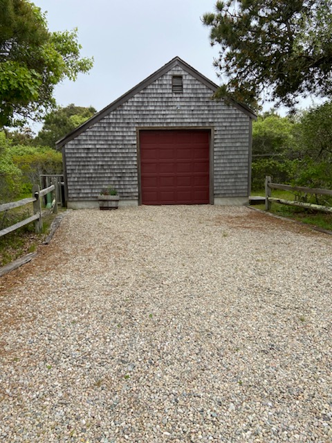 139 Surfside Road Nantucket, MA 02554 - Photo 4 of 24 a front view of a house with a yard