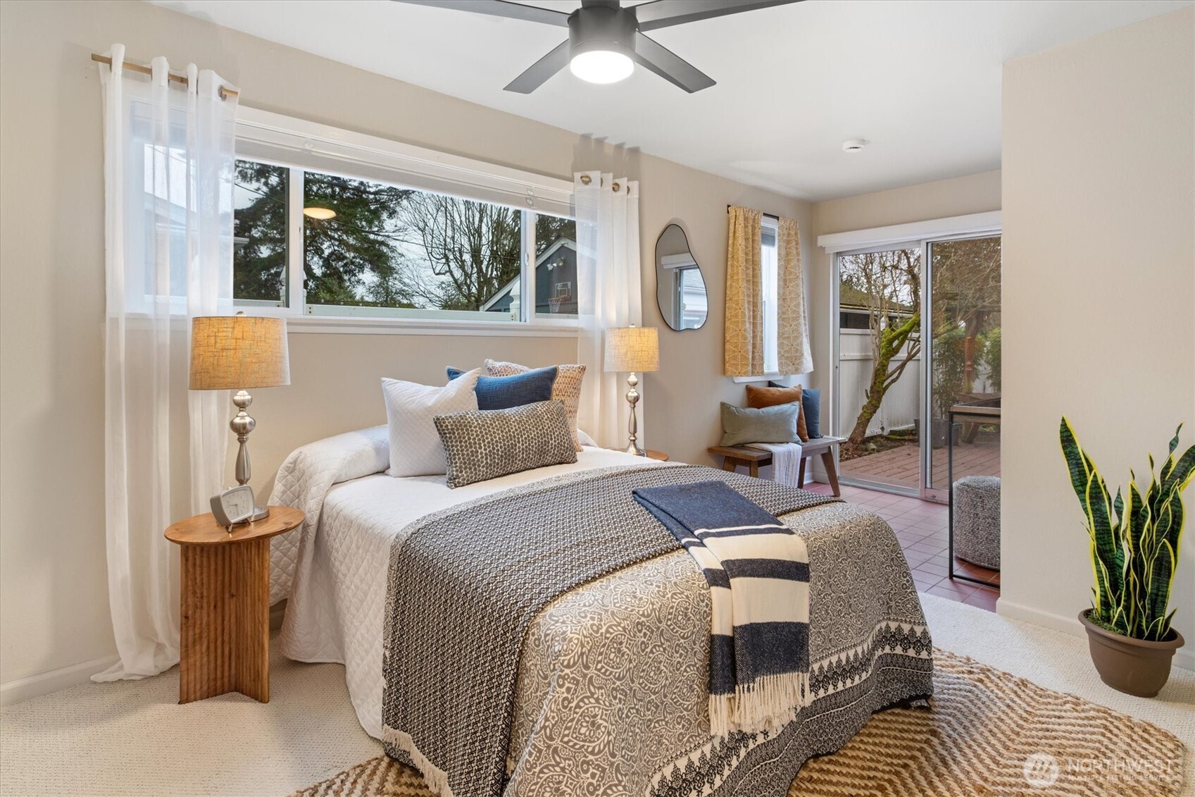 15760 Meridian Avenue North Shoreline, WA 98133 - Photo 12 of 26 a bed room with a bed and a potted plant