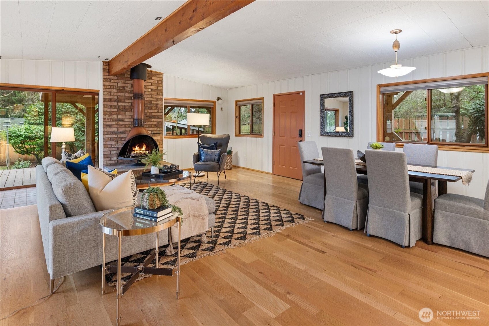 15760 Meridian Avenue North Shoreline, WA 98133 - Photo 6 of 26 a living room with fireplace furniture and a large window