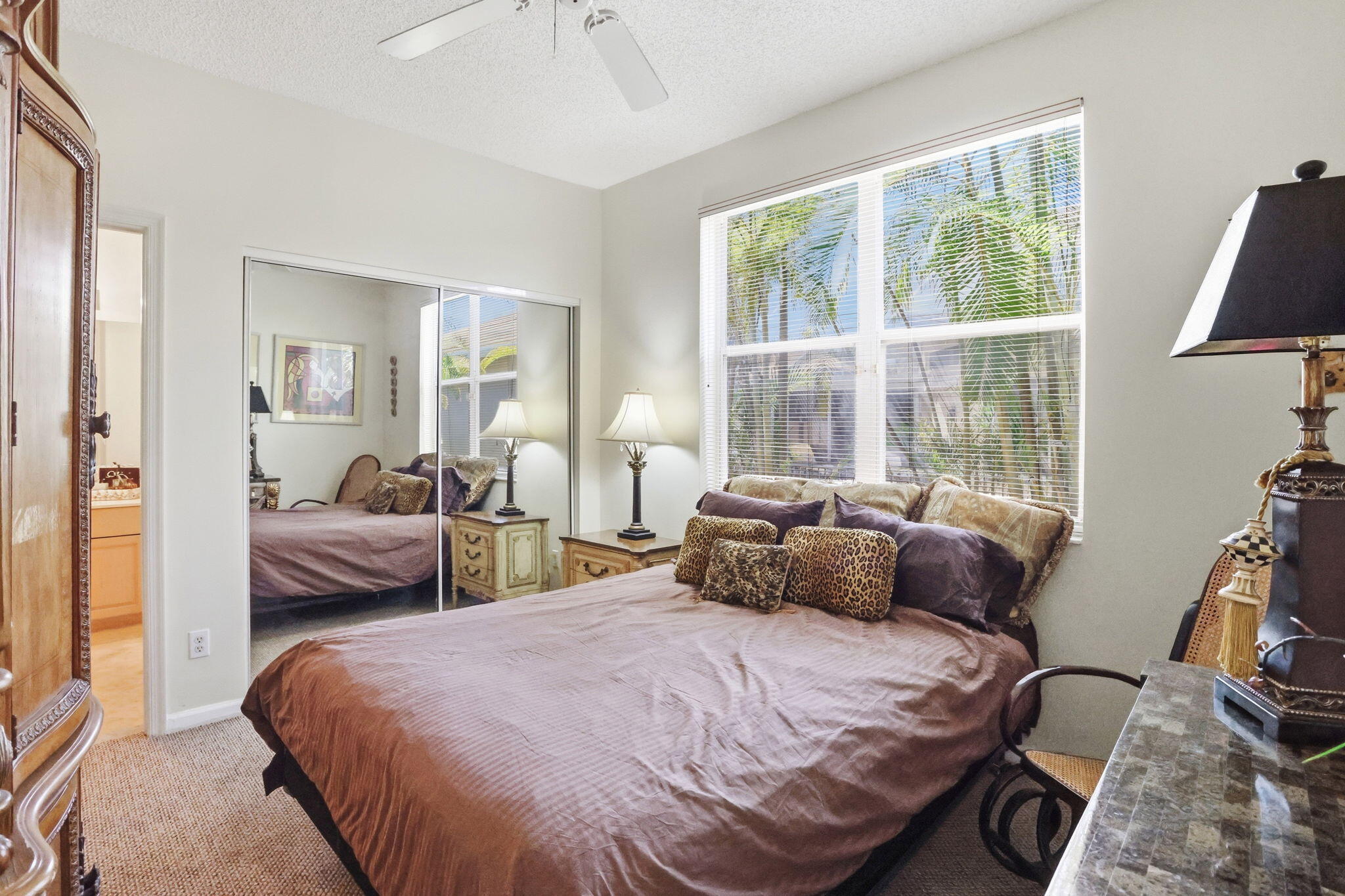 7821 Dorchester Road Boynton Beach, FL 33472 - Photo 11 of 49 a bedroom with a bed and wooden floor