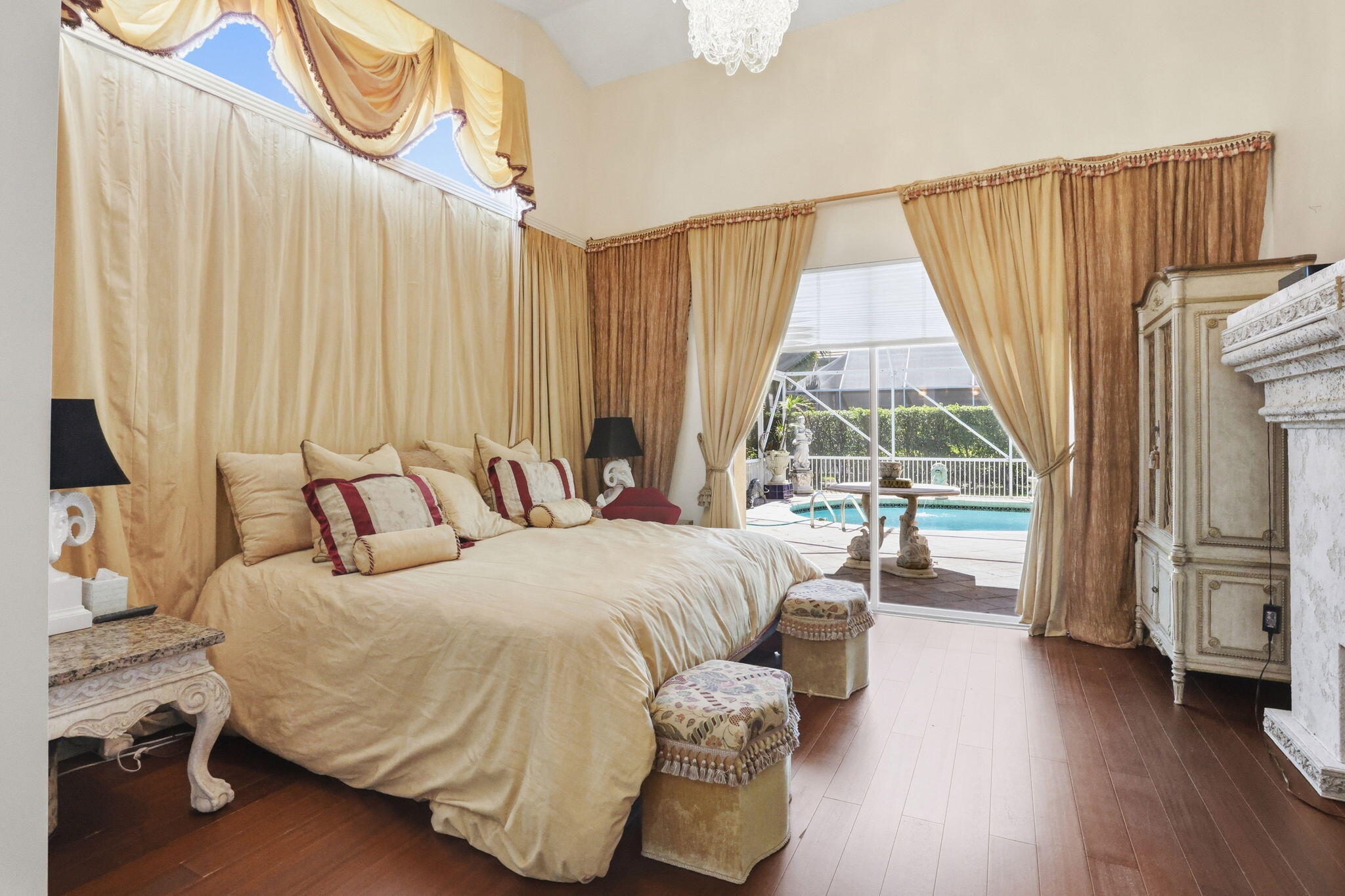 7821 Dorchester Road Boynton Beach, FL 33472 - Photo 17 of 49 a bedroom with bed and a large window