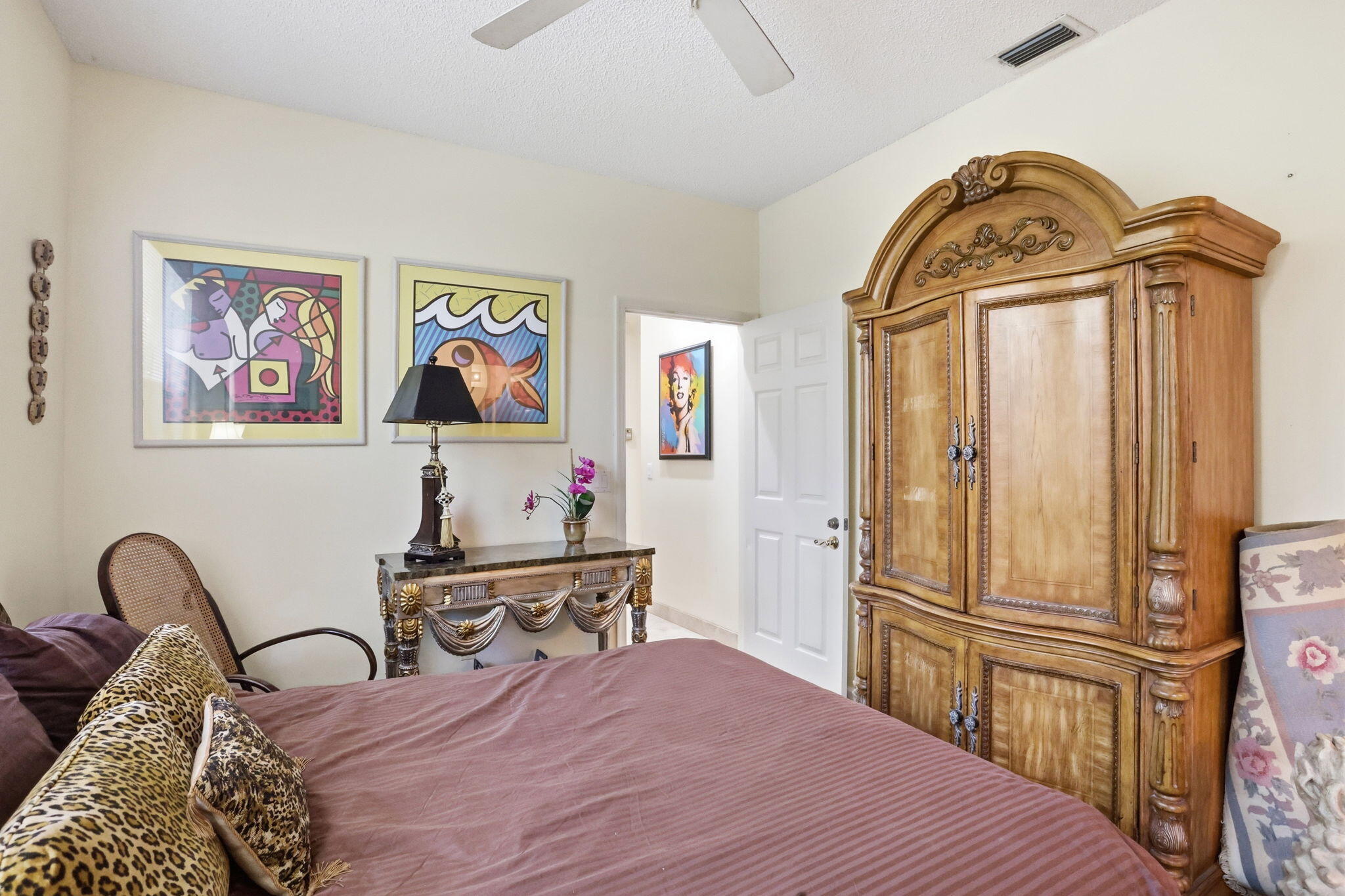 7821 Dorchester Road Boynton Beach, FL 33472 - Photo 30 of 49 a bedroom with a bed and wooden floor