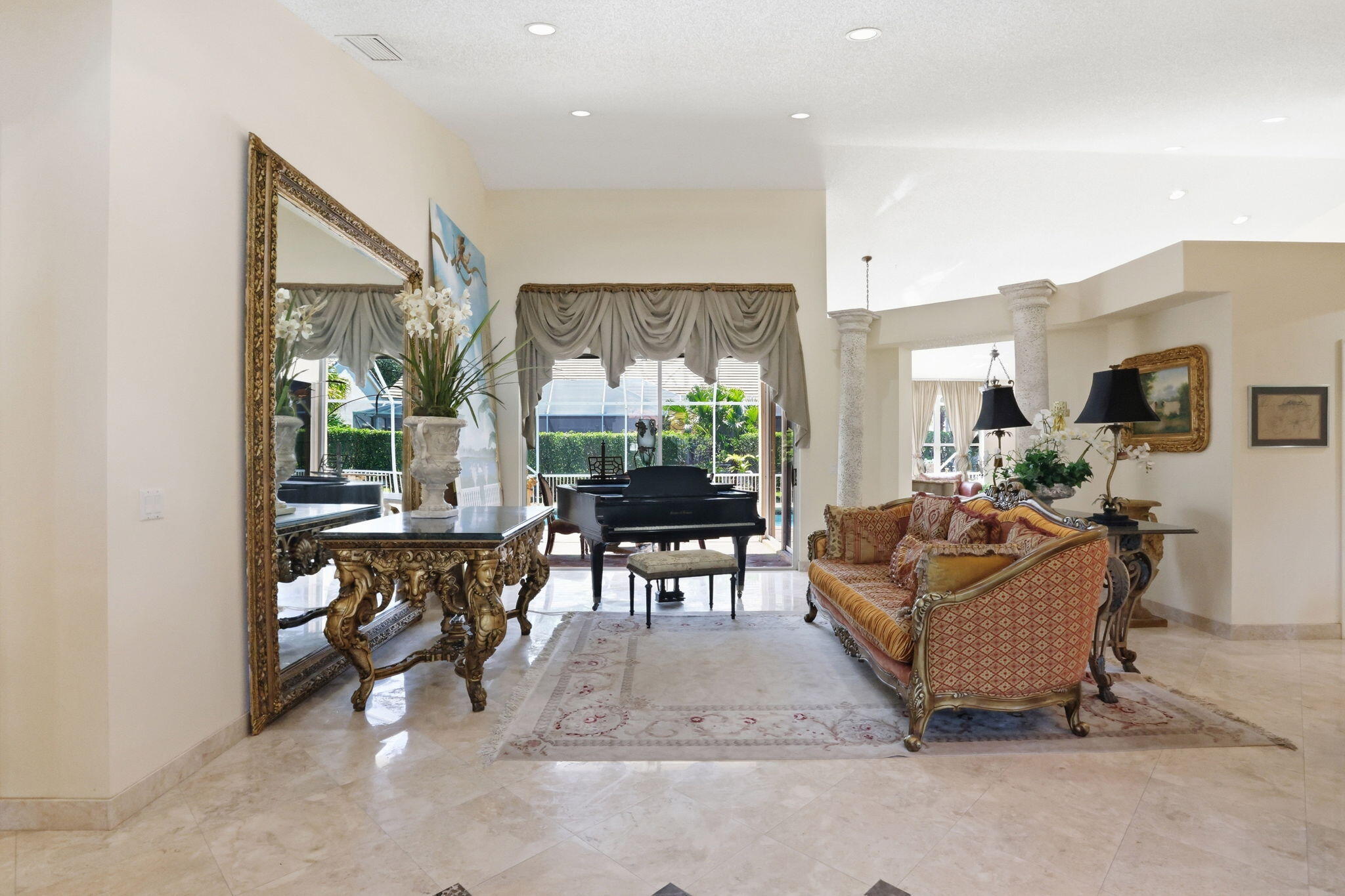7821 Dorchester Road Boynton Beach, FL 33472 - Photo 5 of 49 a living room with furniture and a large window