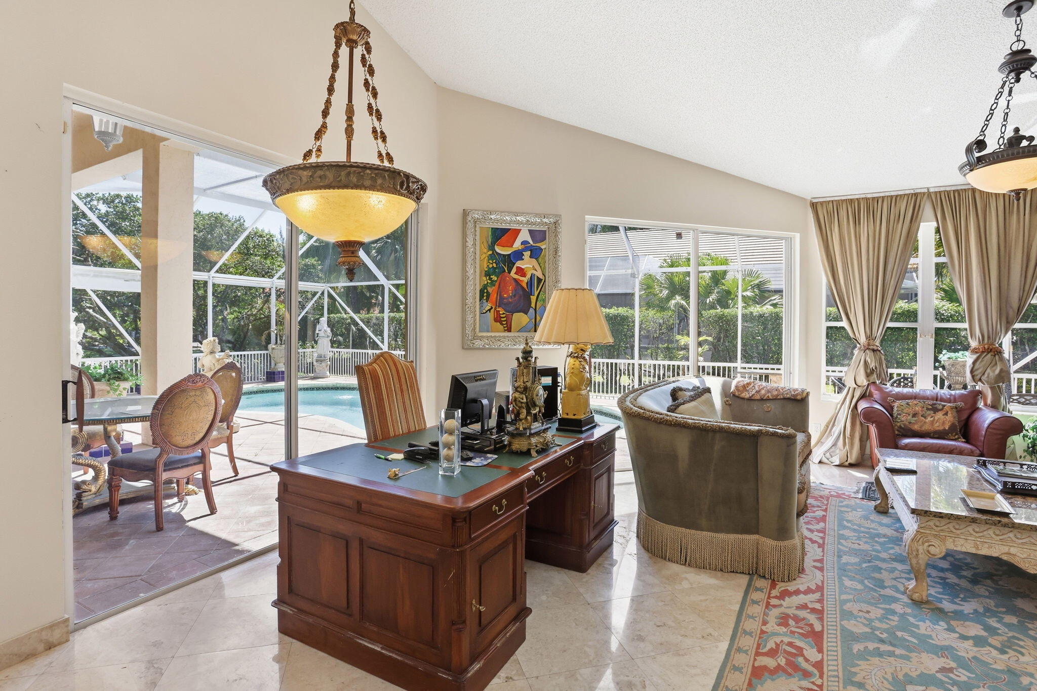 7821 Dorchester Road Boynton Beach, FL 33472 - Photo 10 of 49 a living room with furniture and a chandelier