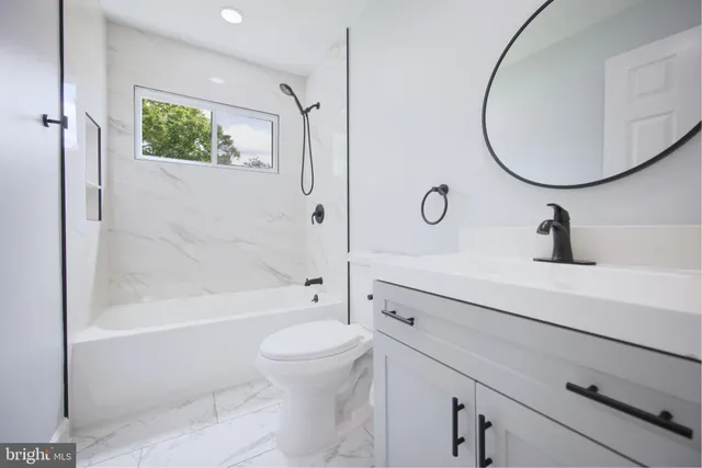 a bathroom with a bath tub and a shower