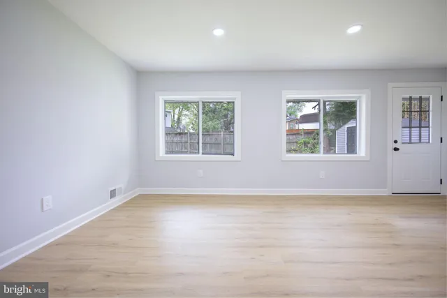 an empty room with windows
