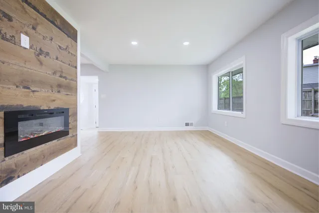 a kitchen with white cabinets and appliances