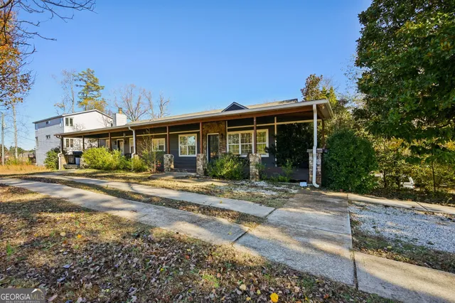a view of a house with a yard and plants