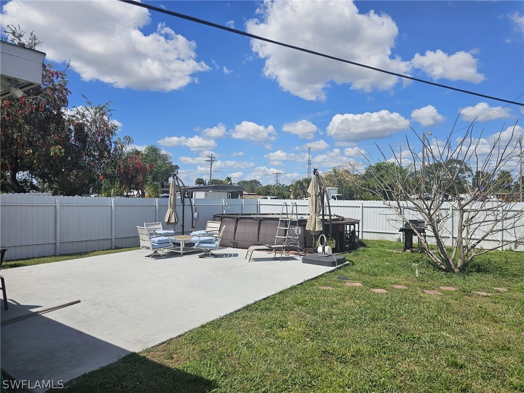 22 Connecticut Road Lehigh Acres, FL 33936 - Photo 3 of 30 a view of a house with backyard and sitting area