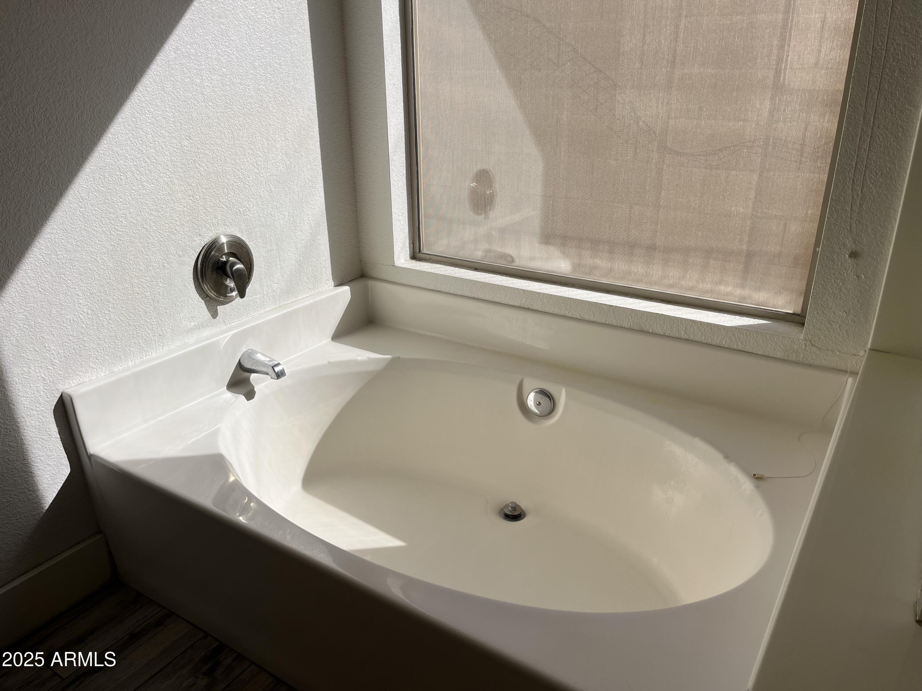 1128 East Sheffield Avenue Gilbert, AZ 85296 - Photo 16 of 24 a bathroom with a sink and mirror