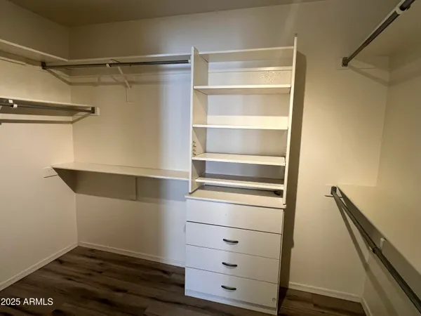 a view of an empty walk in closet