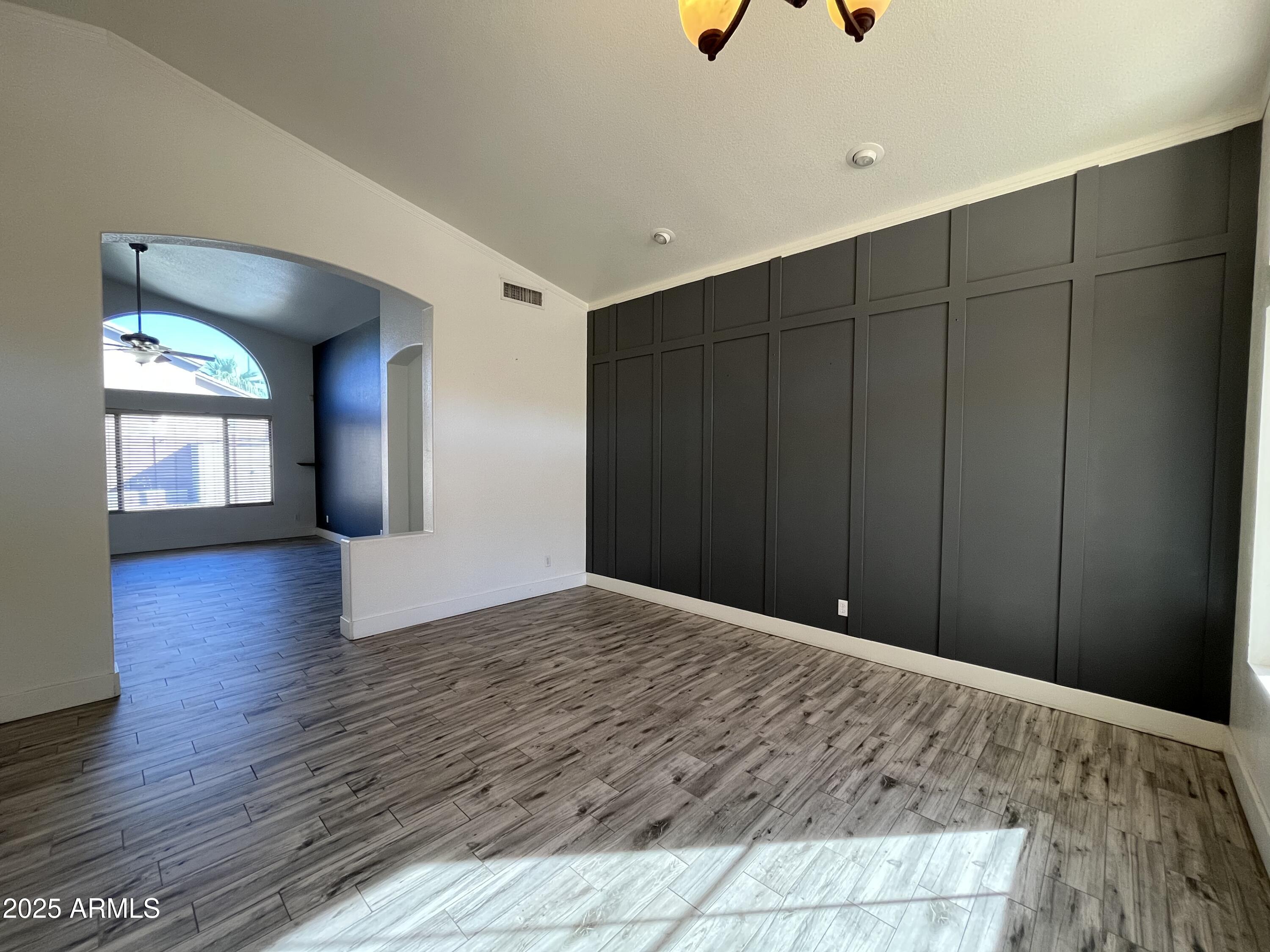 1128 East Sheffield Avenue Gilbert, AZ 85296 - Photo 4 of 24 a view of a livingroom with wooden floor