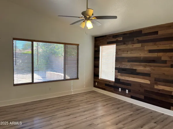 a view of room with window and ceiling fan