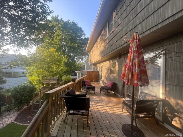 a view of balcony with furniture