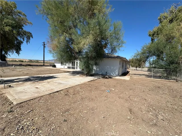 a view of a backyard of the house